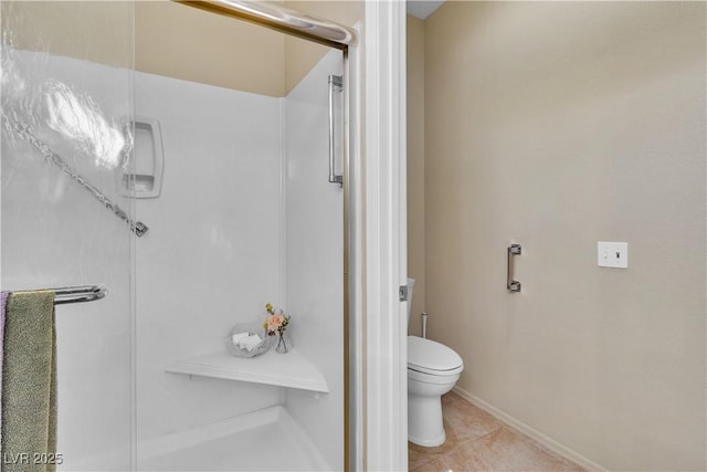 full bath with tile patterned flooring, a stall shower, toilet, and baseboards