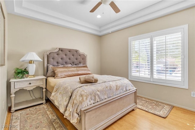 bedroom with recessed lighting, baseboards, light wood-type flooring, and ceiling fan