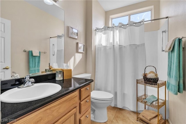 full bath featuring tile patterned flooring, curtained shower, toilet, and vanity