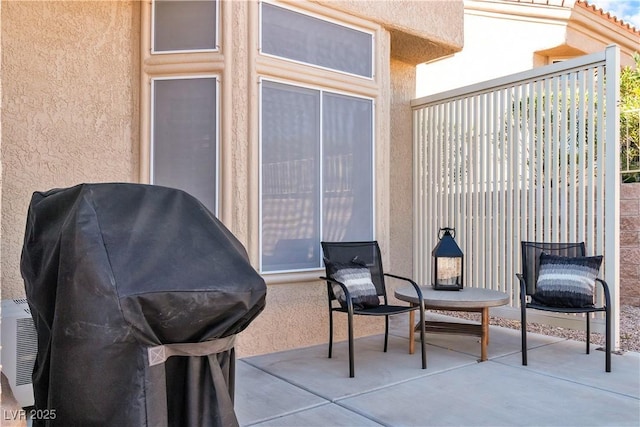 view of patio featuring a grill