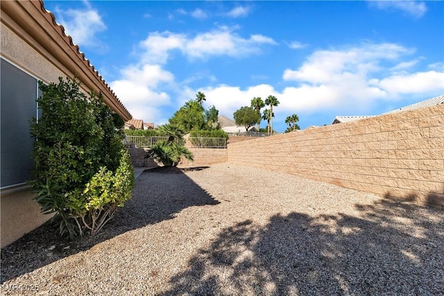 view of yard with a fenced backyard