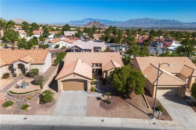 aerial view with a mountain view and a residential view