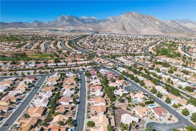 bird's eye view with a residential view and a mountain view