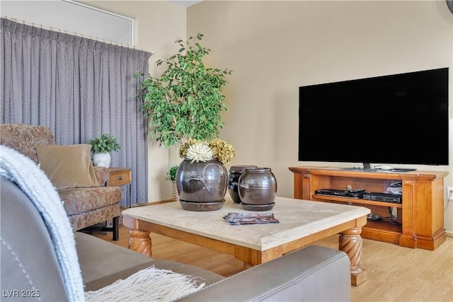 sitting room with light wood-style flooring