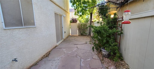 view of patio featuring fence