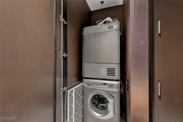 laundry area with laundry area and stacked washer and clothes dryer