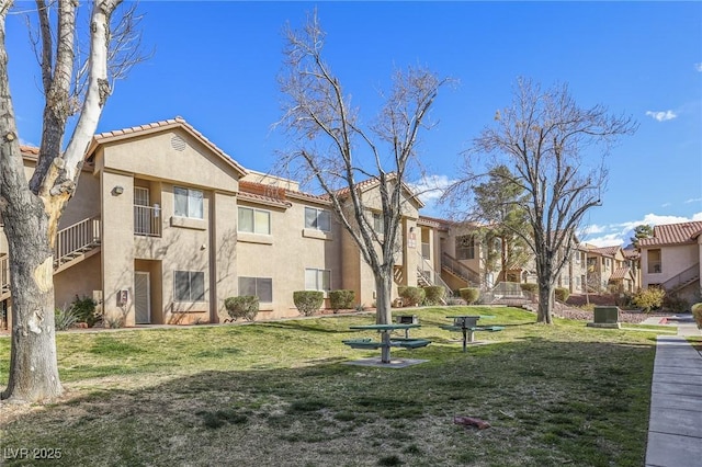 view of property's community with a residential view and a yard