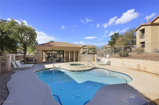 pool featuring a gazebo, a patio, fence, and a hot tub