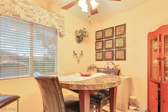 dining room featuring ceiling fan