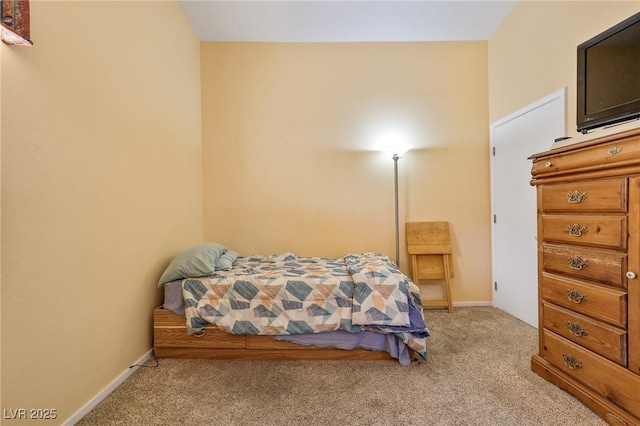 carpeted bedroom with baseboards