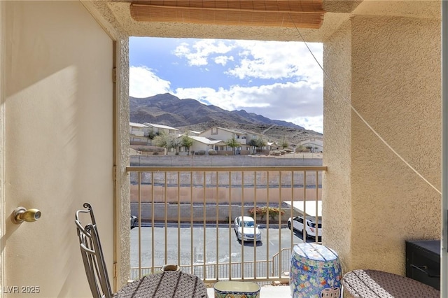 balcony featuring a mountain view