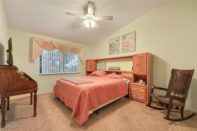 bedroom featuring a ceiling fan, vaulted ceiling, light colored carpet, and baseboards