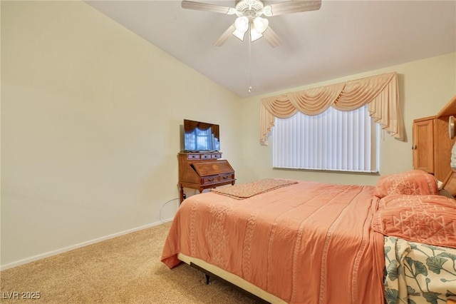 carpeted bedroom featuring a ceiling fan, baseboards, and vaulted ceiling