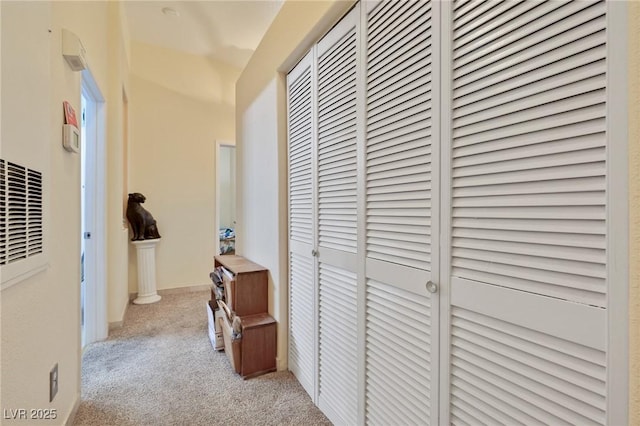 corridor with carpet flooring