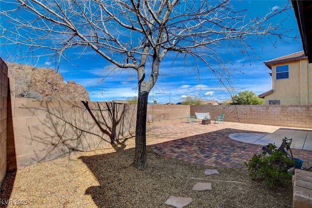 view of yard with a fenced backyard and a patio