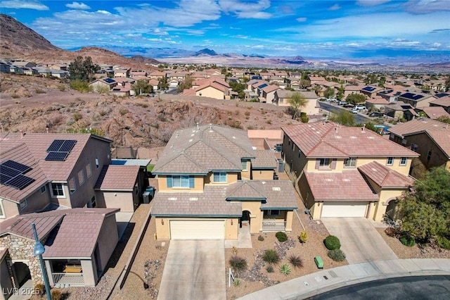 bird's eye view featuring a mountain view and a residential view