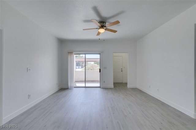 unfurnished room featuring wood finished floors, baseboards, and ceiling fan