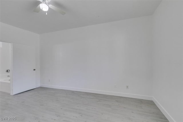 spare room with a ceiling fan, baseboards, and light wood finished floors