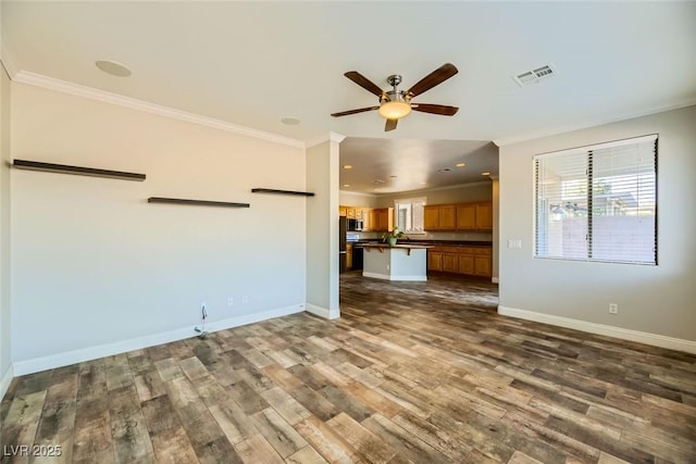 unfurnished living room with visible vents, crown molding, baseboards, a ceiling fan, and dark wood-style flooring