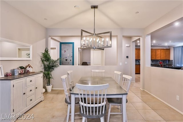 dining area with a notable chandelier, light tile patterned floors, recessed lighting, and baseboards