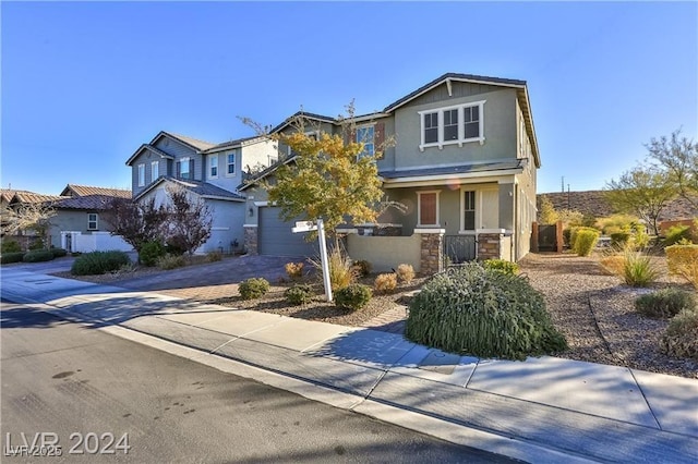 view of front of house featuring stone siding, stucco siding, decorative driveway, and a garage