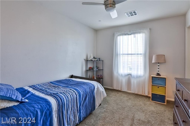 bedroom with visible vents, baseboards, a ceiling fan, and carpet flooring