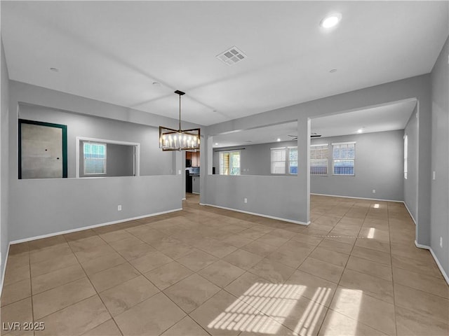 interior space featuring visible vents, baseboards, light tile patterned floors, recessed lighting, and a notable chandelier