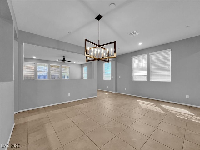 empty room with visible vents, baseboards, recessed lighting, ceiling fan with notable chandelier, and light tile patterned flooring