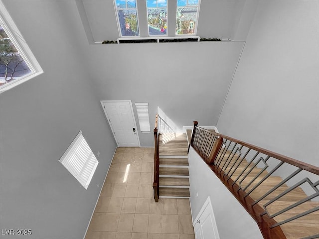 stairs with tile patterned flooring