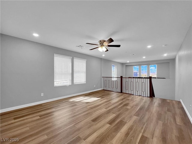 unfurnished room with visible vents, recessed lighting, baseboards, and light wood-style floors