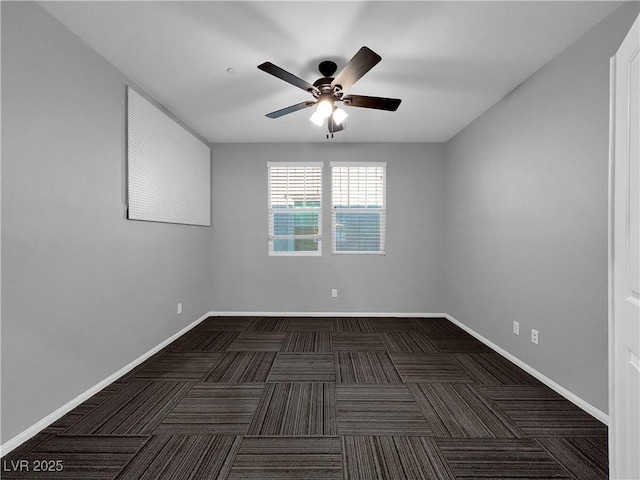 empty room featuring carpet flooring, ceiling fan, and baseboards