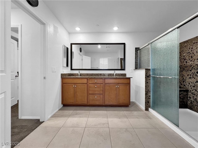 full bathroom featuring tile patterned flooring, double vanity, recessed lighting, and a stall shower