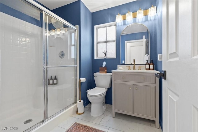 bathroom with vanity, a shower stall, toilet, and marble finish floor