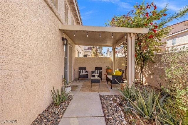 view of patio / terrace featuring fence