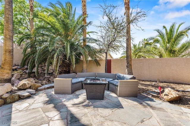 124 Beach Oak Ave, Henderson, NV 89002 - view of patio with a fenced backyard and an outdoor living space with a fire pit