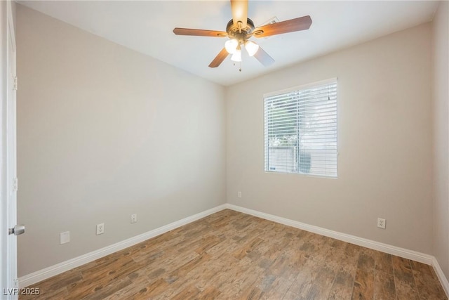 unfurnished room with ceiling fan, baseboards, and wood finished floors