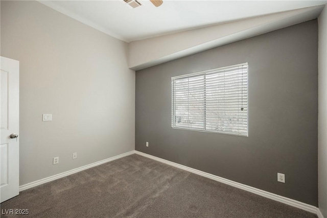 spare room with visible vents, carpet, and baseboards