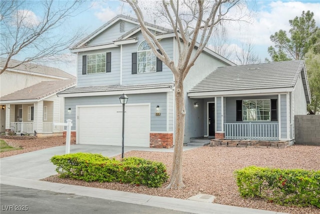 traditional home featuring brick siding, covered porch, an attached garage, and concrete driveway