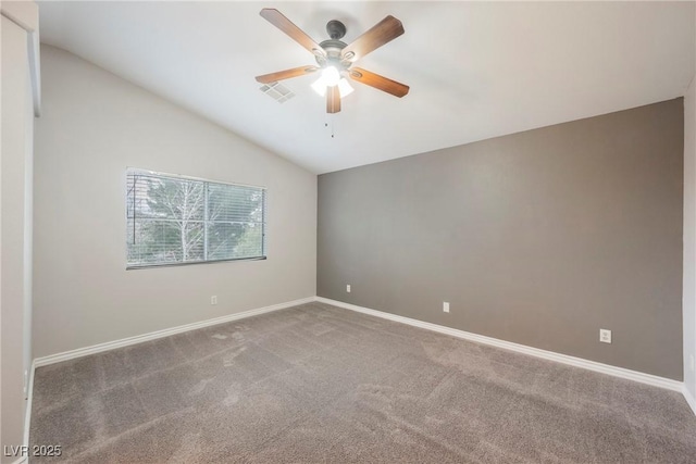 spare room with a ceiling fan, baseboards, visible vents, lofted ceiling, and carpet flooring