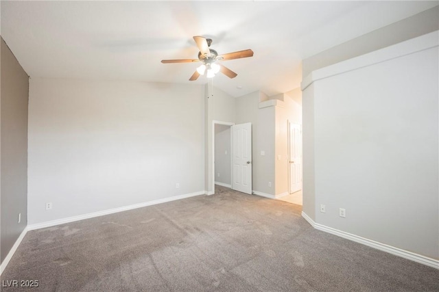 carpeted empty room with baseboards, lofted ceiling, and ceiling fan