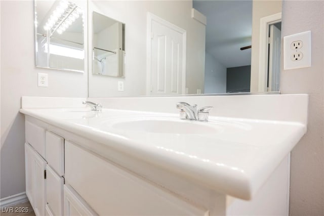 full bath with a sink and double vanity