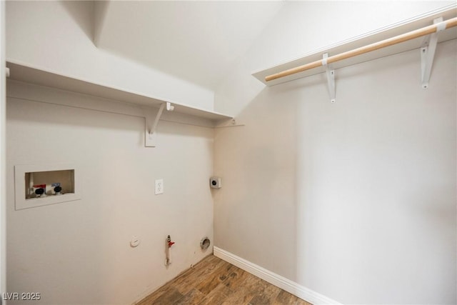 laundry area with baseboards, hookup for a gas dryer, hookup for a washing machine, wood finished floors, and electric dryer hookup