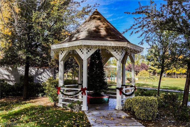 surrounding community with a gazebo and a yard