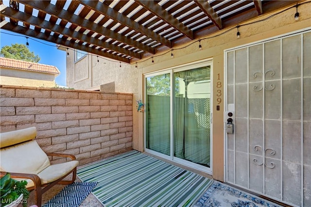 balcony featuring a pergola