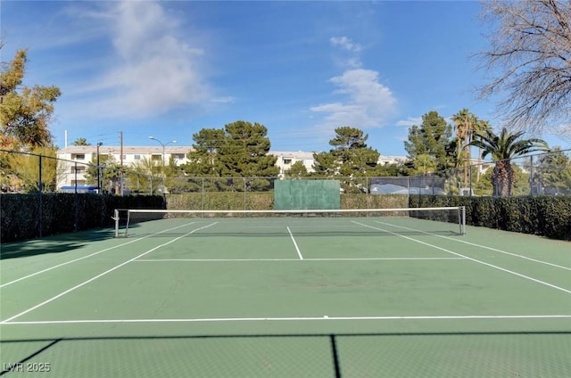 view of sport court with fence