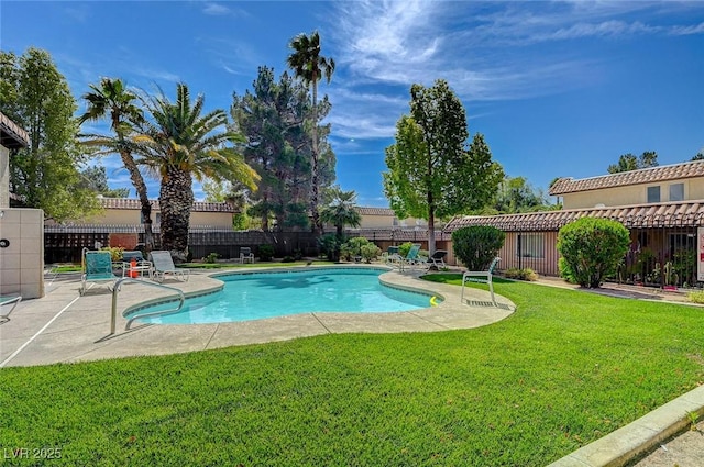 view of pool with a fenced in pool, a lawn, a fenced backyard, and a patio area