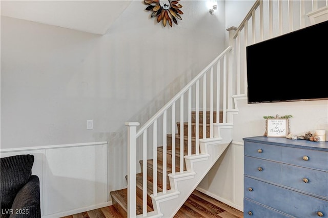 staircase featuring wood finished floors