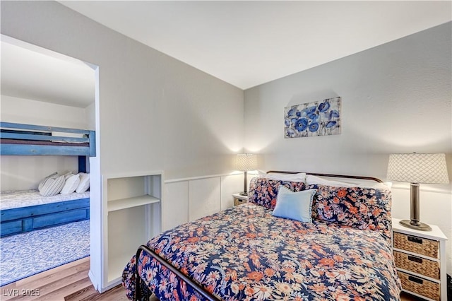 bedroom featuring wood finished floors