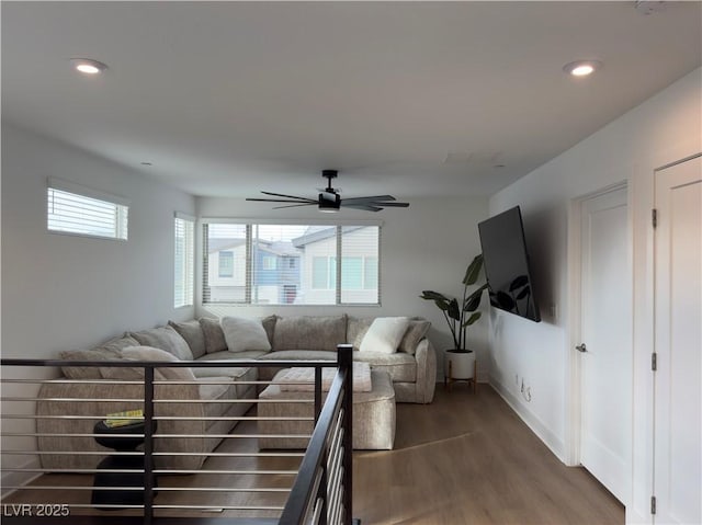 living room with recessed lighting, baseboards, ceiling fan, and wood finished floors