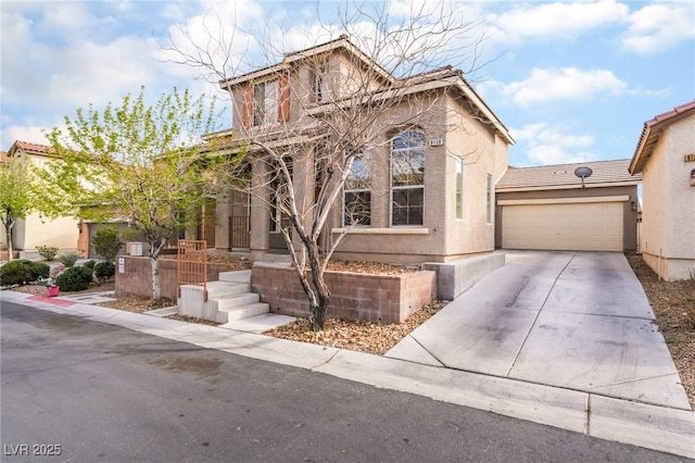 view of front of home with a garage, driveway, and stucco siding